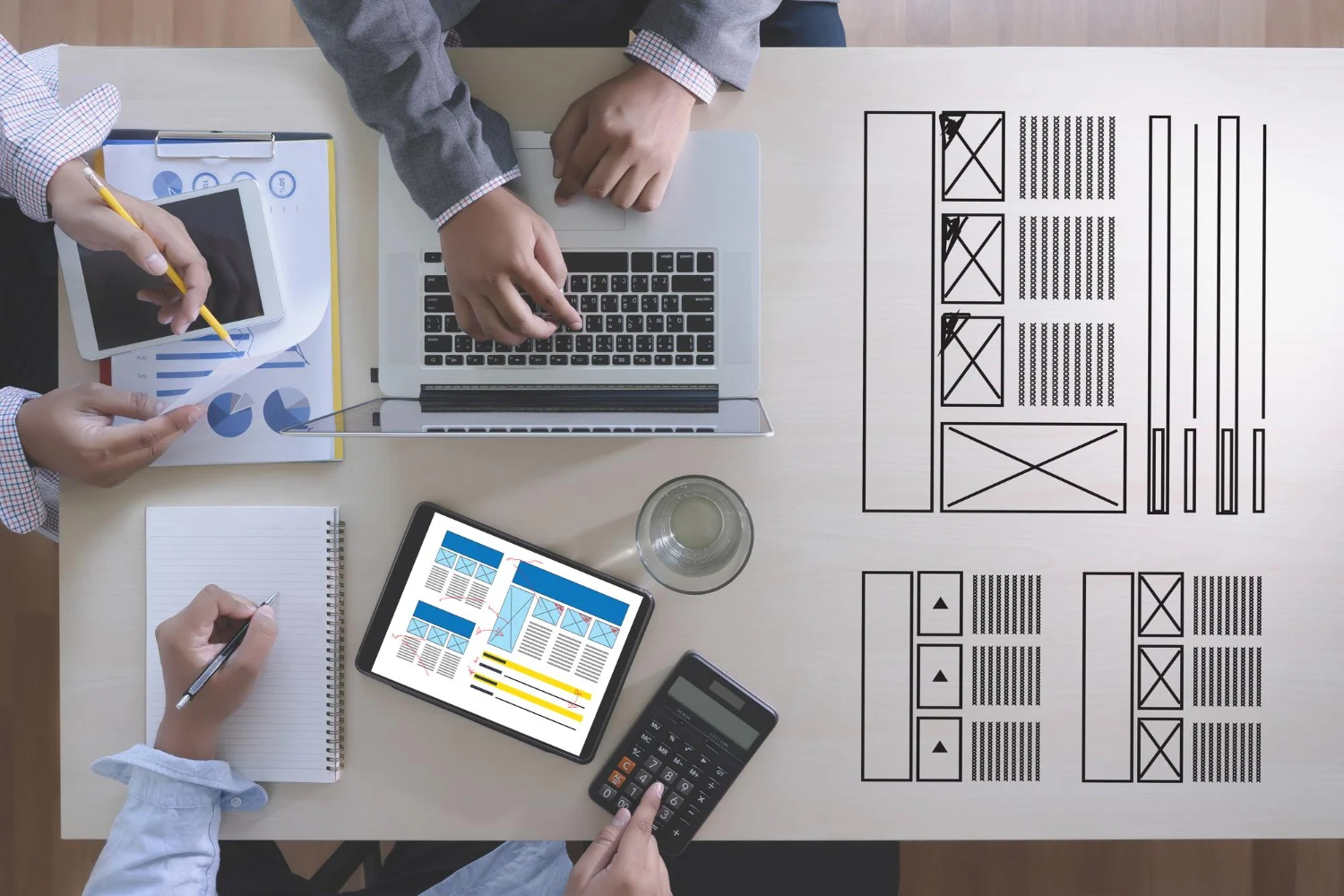 Technical team collaborating on a high-fidelity Figma design system and information architecture for a B2B industrial web design project.